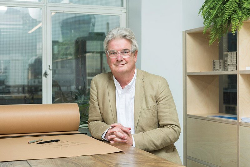 Derbyshire takes over a drafting table in his Aldgate office.