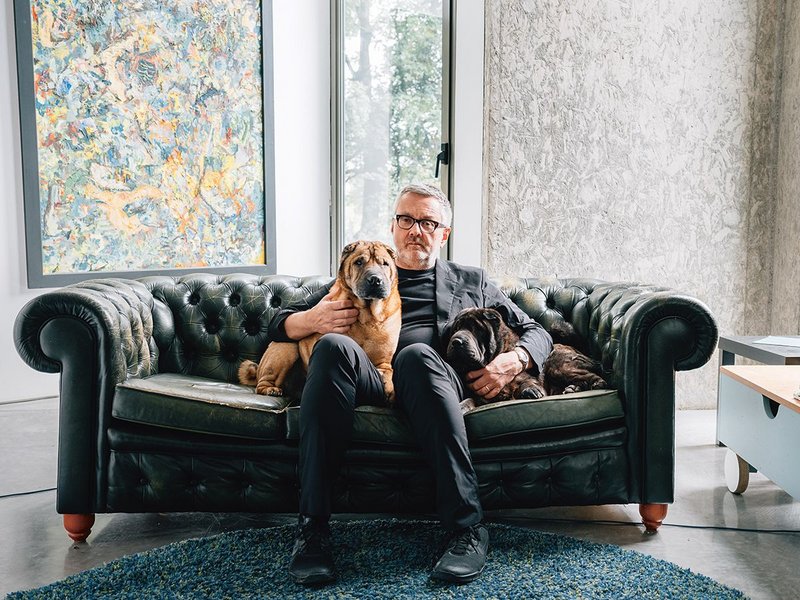 At home with his architecture and his dogs.