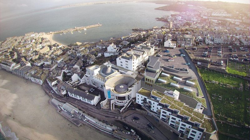 Exterior visualisation showing the entire Tate St Ives redevelopment, including sheltered housing and the green roof over the new galleries.