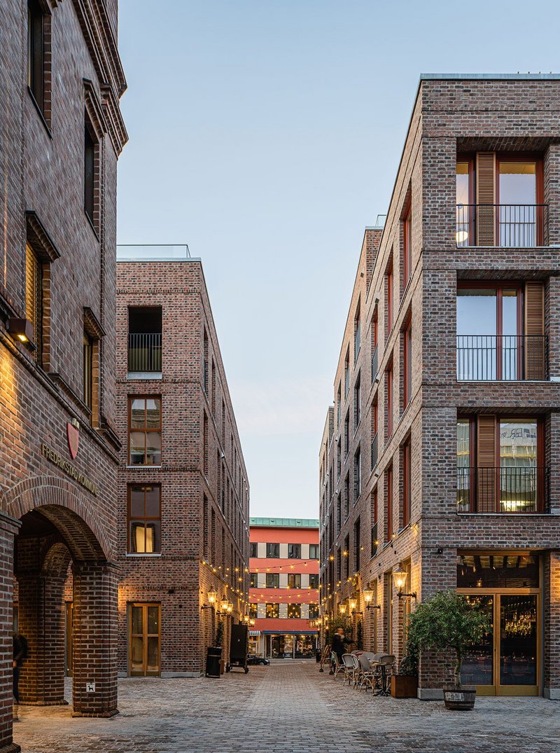 View between new Nygaardsplassen buildings that reinstate the square and a passage.