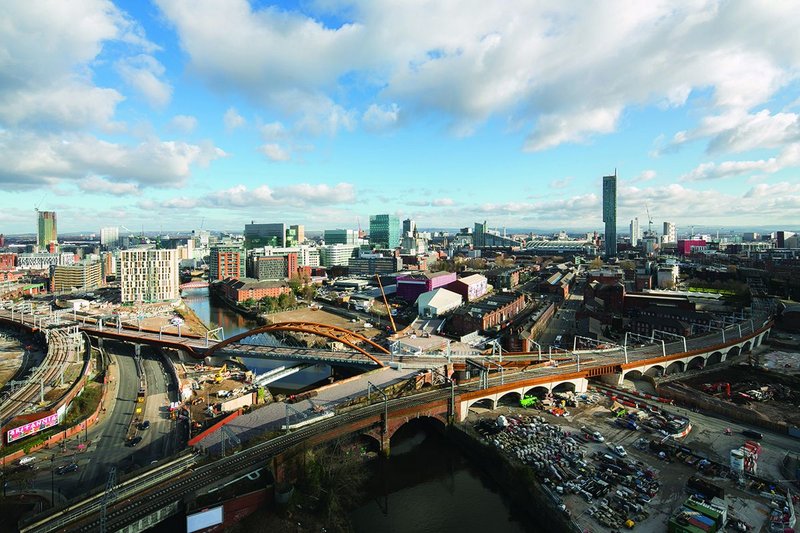 Ordsall Chord combines an asymmetric arch bridge over the river with an I girder road bridge.