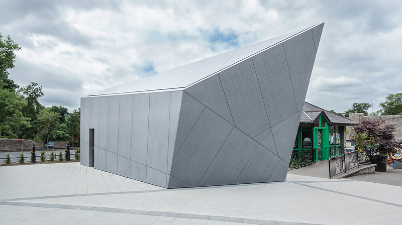 Cahir public toilets in Co Tipperary clad in Equitone Linea: Presenting the building as one single grey volume that reflects the colour and massing of the local limestone.