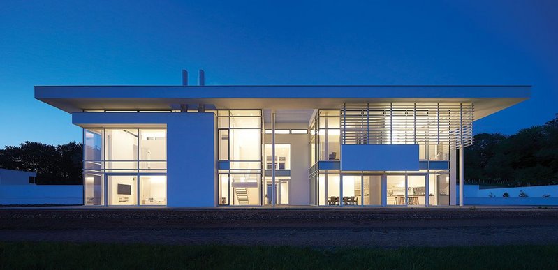 Full height curtain walling and sliding doors create a spectacular glazed main elevation.