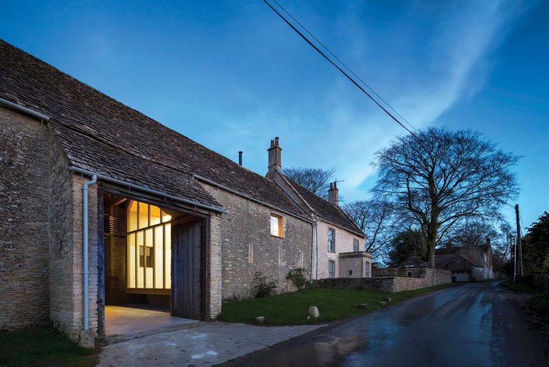 Stonewood Design’s Pod Gallery outside Bath creates an extended living ‘pod’ attached to an existing home but hidden by the walls of the neighbouring barn.