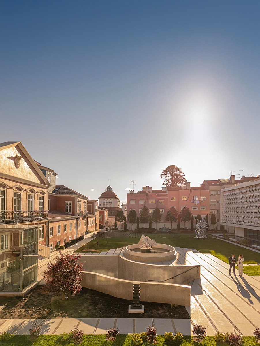 The new and old facades face each other across the courtyard, with a stairwell leading down to the palace's ground floor.