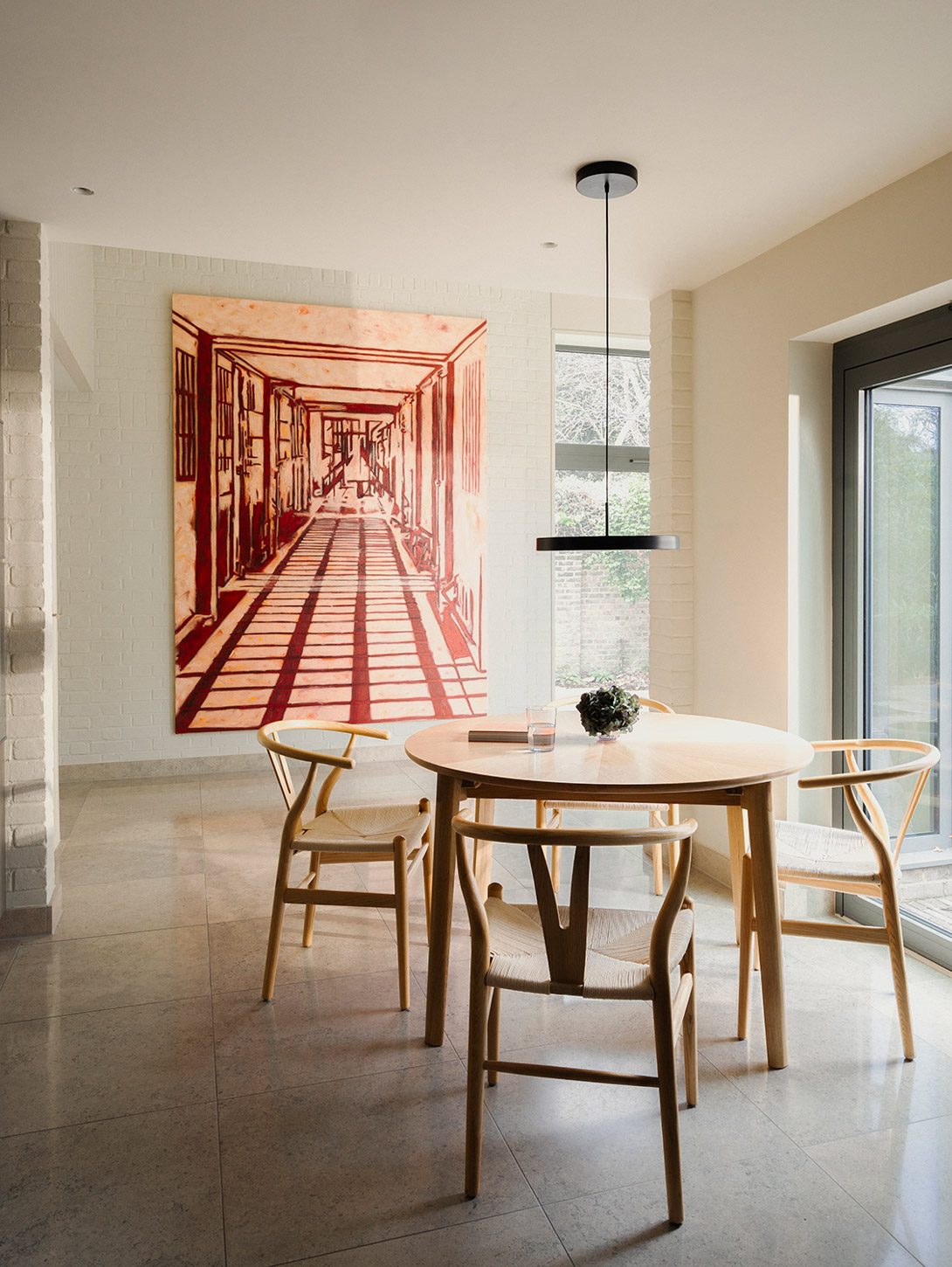 Neutral walls provide display space for artwork.
