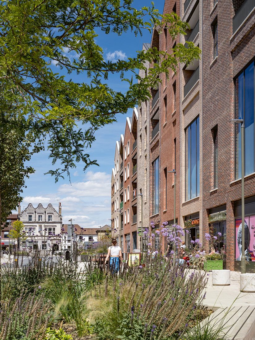 The cinema bar looks onto the newly landscaped street through double-height windows.