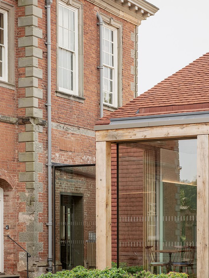 A fully glazed link to Hanbury Hall’s south wing is by IQ Glass. The terracotta roof has a slot gutter made of specials that render it almost invisible.
