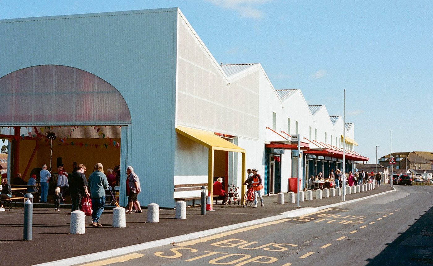A translucent arch highlights the entrance to the market hall.