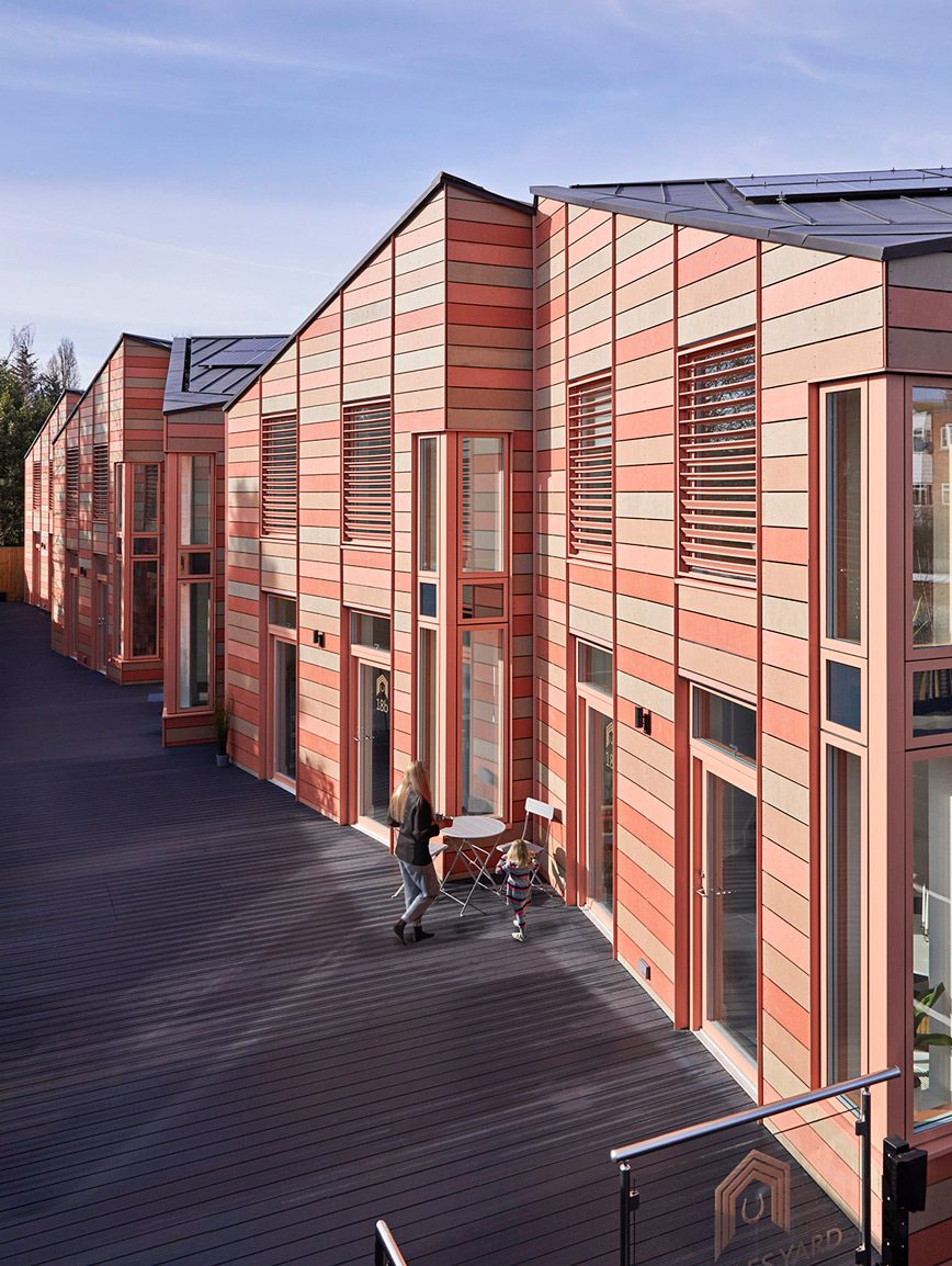 The six houses share a raised deck.