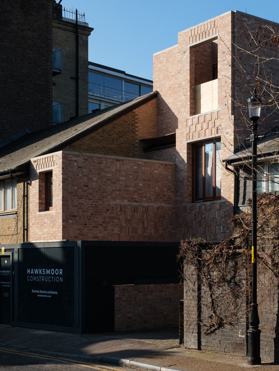 House under construction in Borough Market, London. Reclaimed bricks are laid in lime mortar so they can be reused.