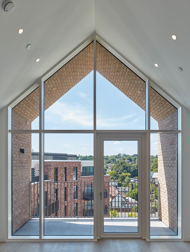 This inset balcony is one of many outdoor amenity spaces that Runnymede Council wanted for its residents, both private and social.