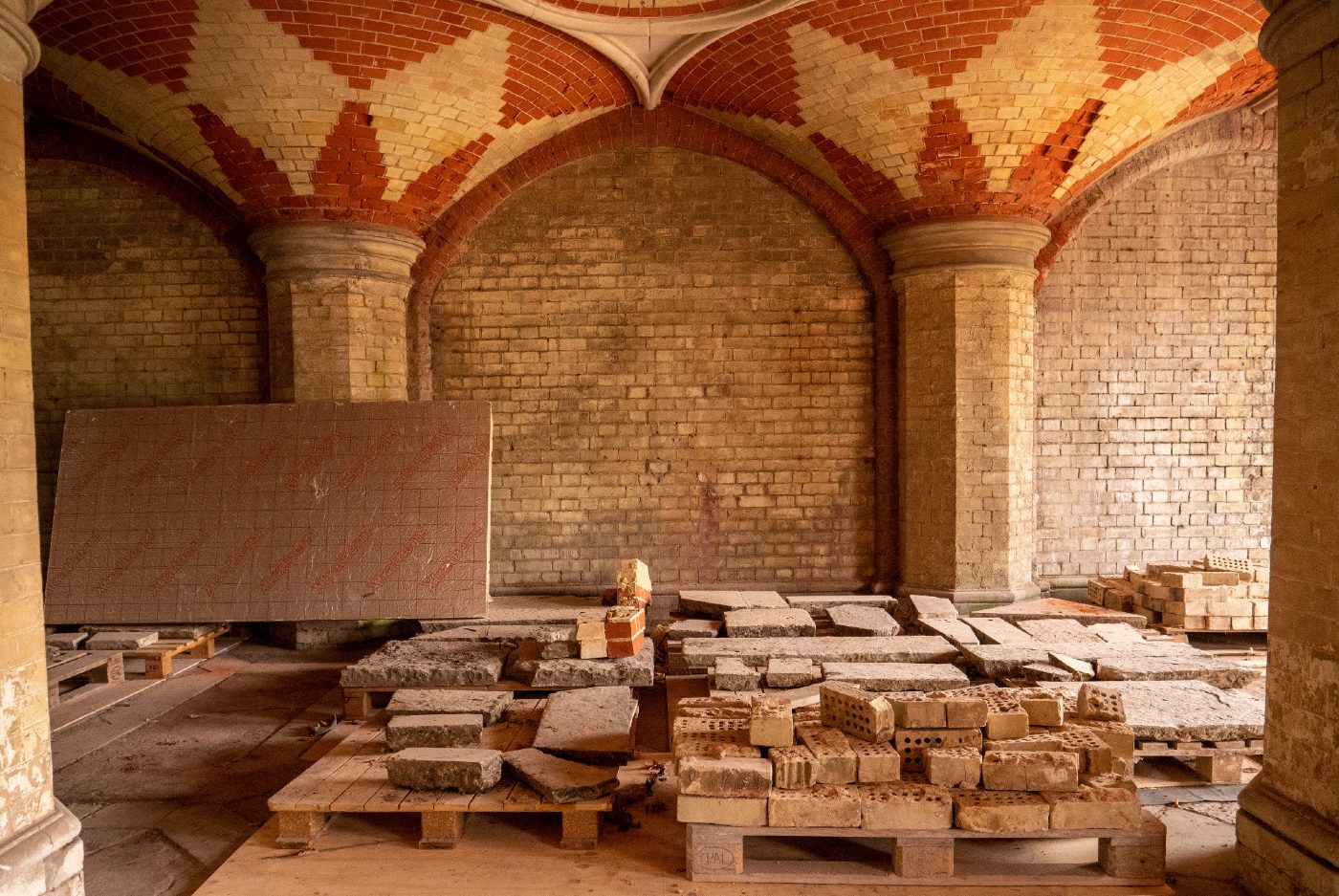 Crystal Palace Subway restoration showing vaulted space and reclaimed brick in storage.
