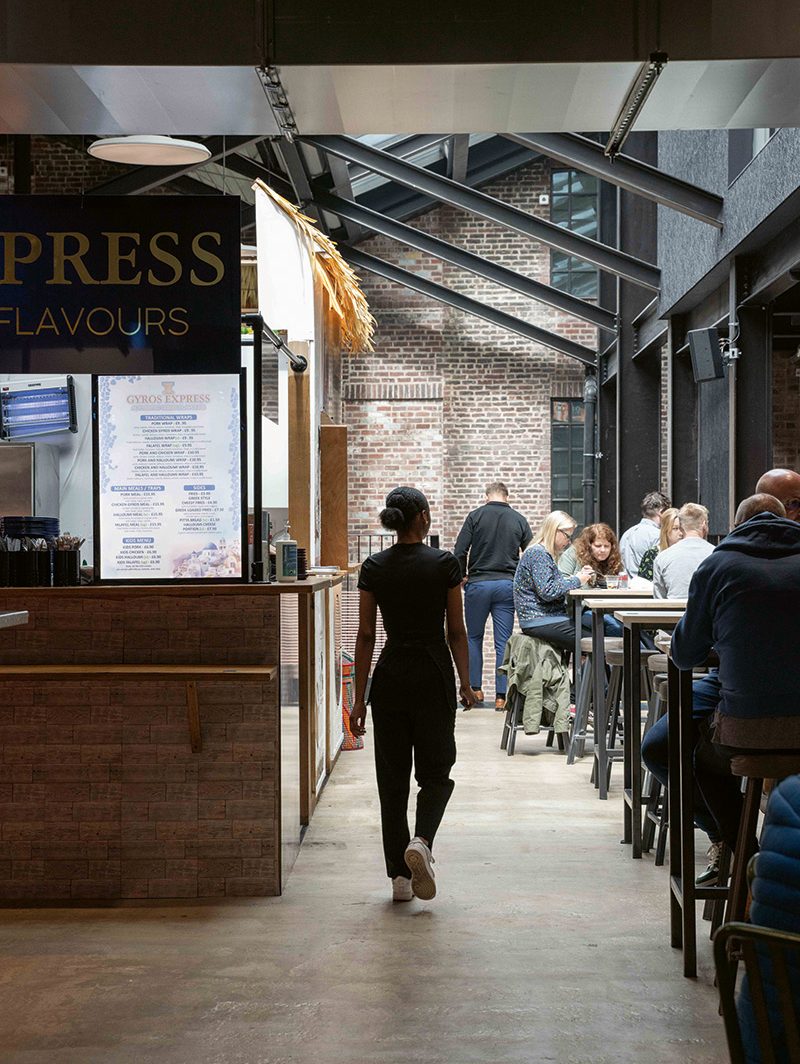 Former brick openings can be seen on the inside of the food hall.